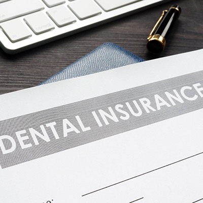 Dental insurance form on desk. 
