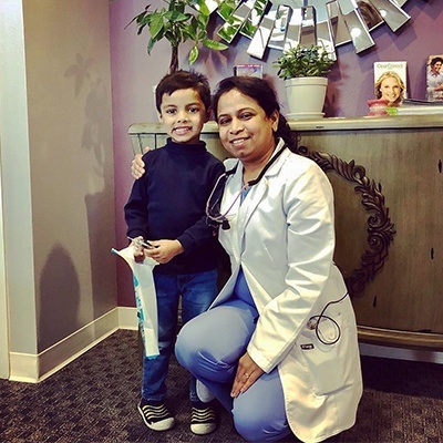 Smiling young patient with dentist