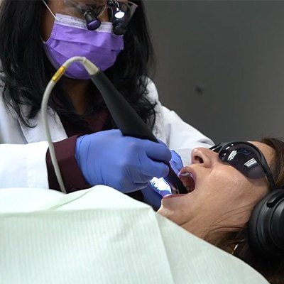 Dentist using cavity detection tool