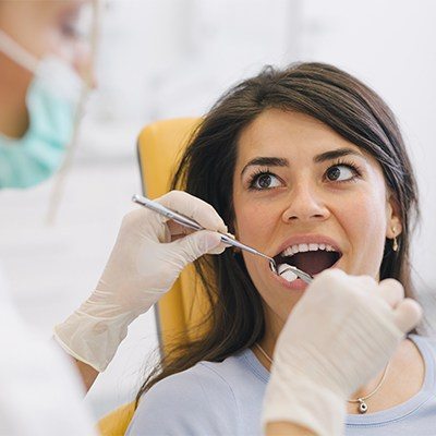 Young woman receiving dental treatment